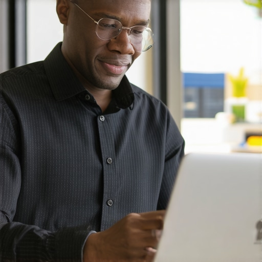 Gilbert GMB Optimization Business owner optimizing Google My Business profile on laptop with Gilbert storefront background